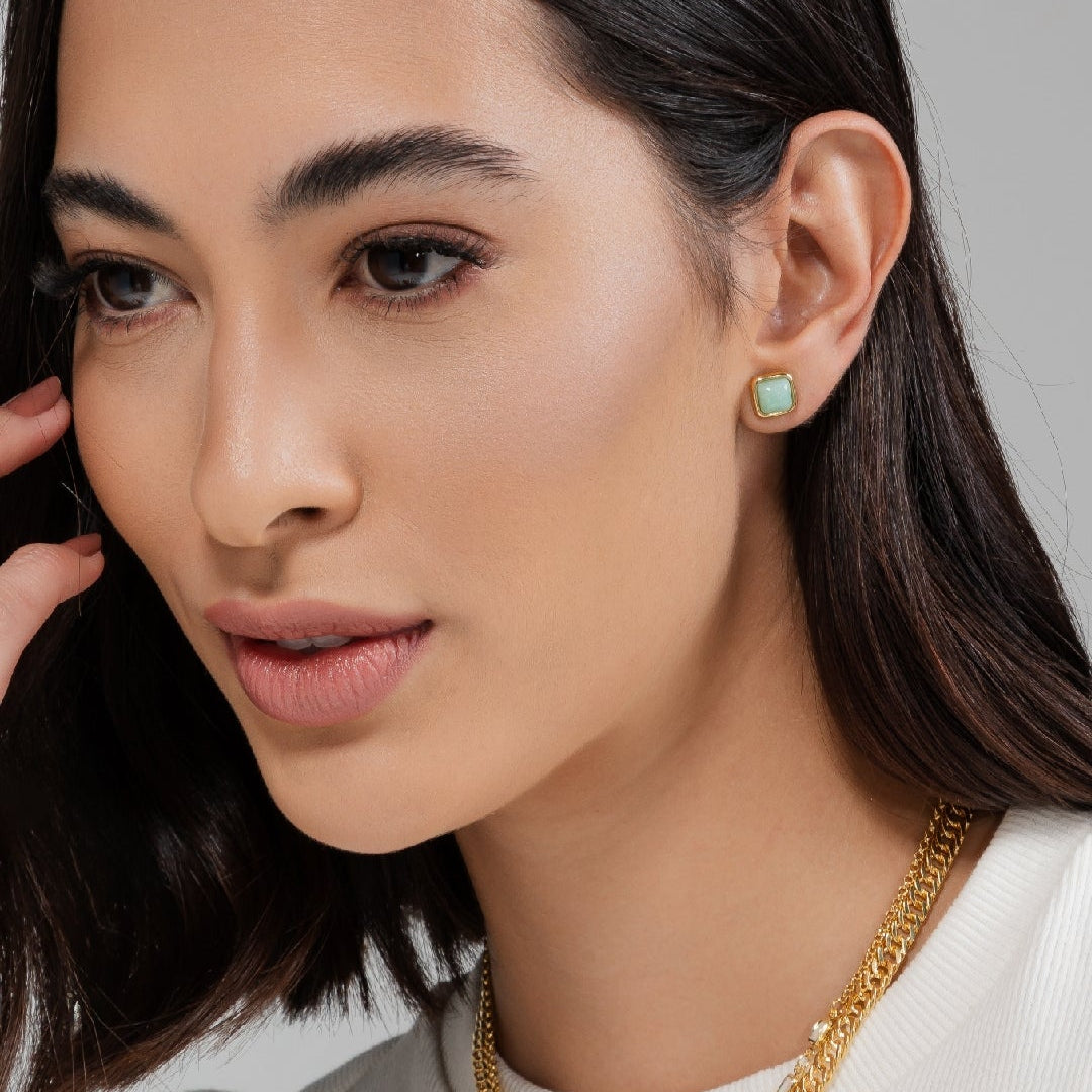 green gemstone golden earrings