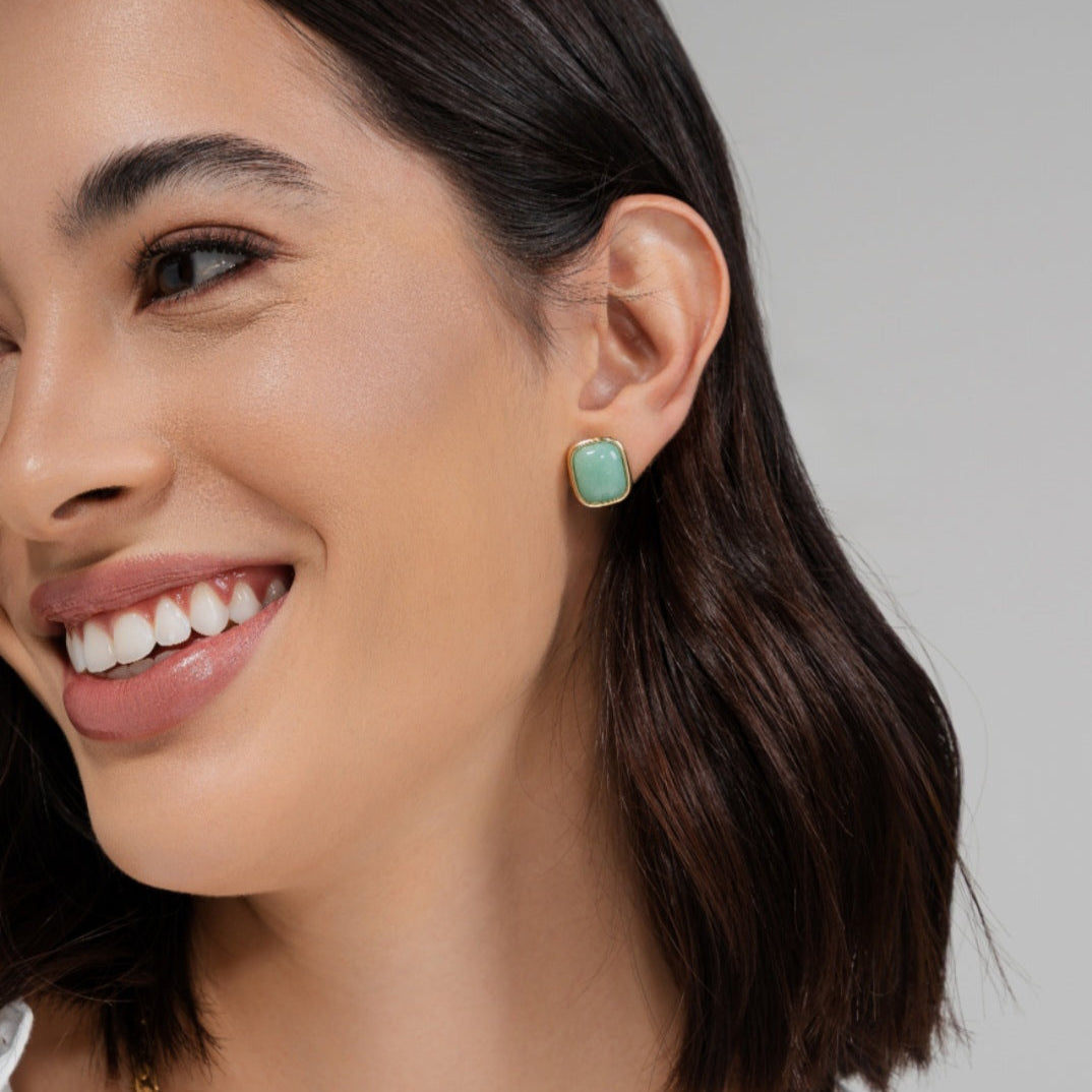 green stone golden earrings