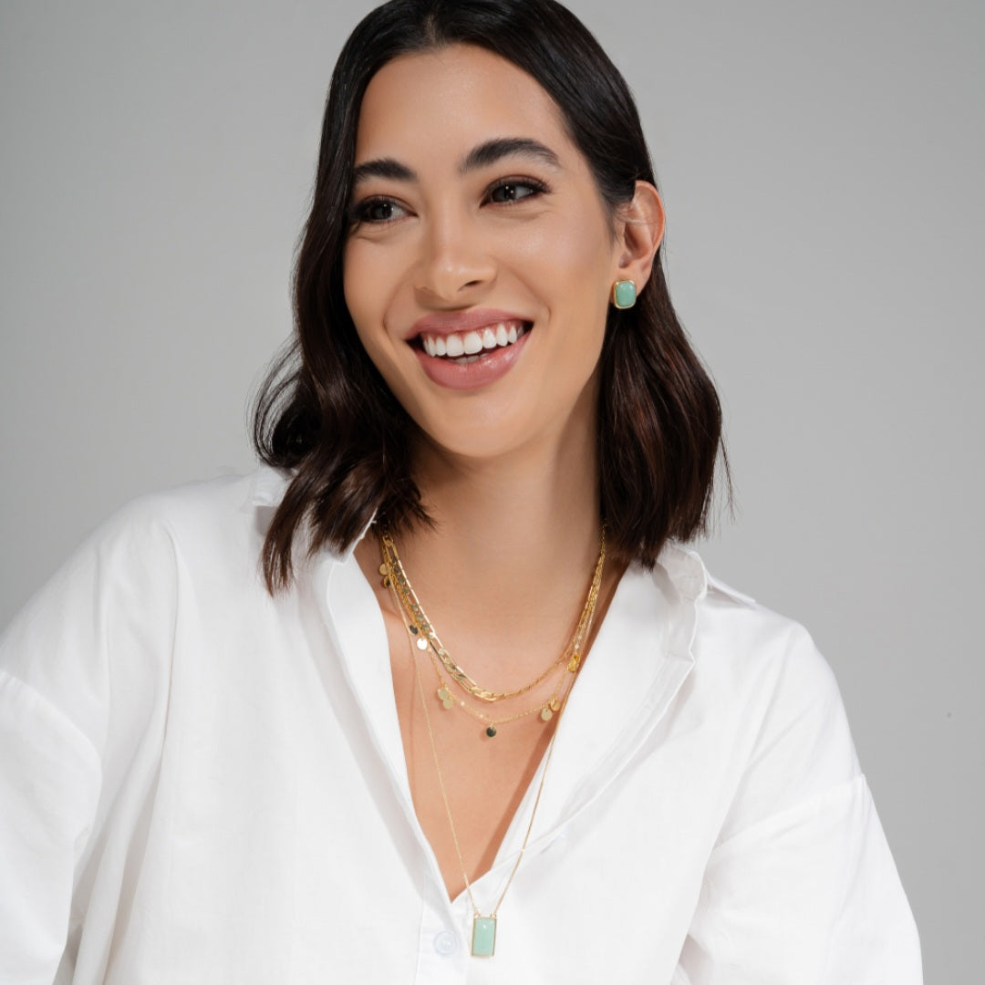 green stone goden earrings